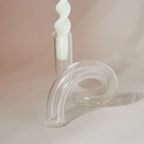 Unique glass vase with spiral design and candle