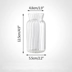 Clear glass vase with measurements.
