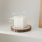 White cube candle on wood slice - 6cm dimensions