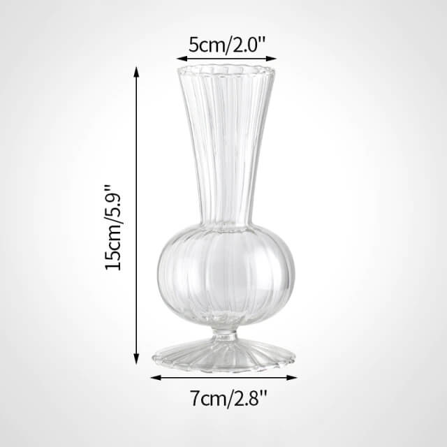 Clear glass vase with ribbed design.