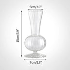 Clear glass vase with ribbed design.