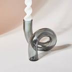 Unique grey glass candle holder with white candle