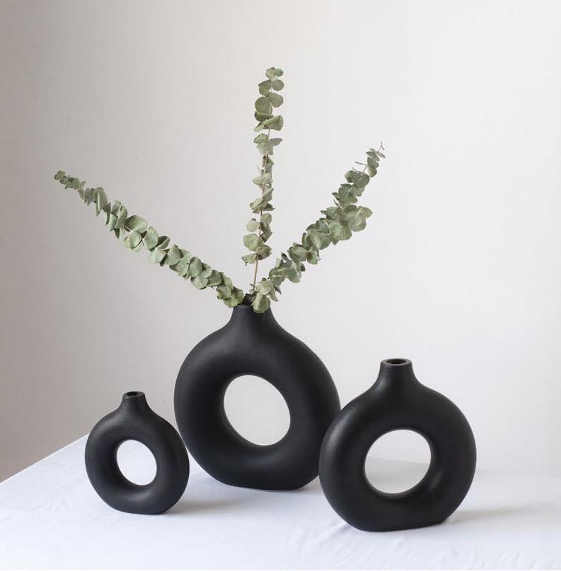 Black donut vases with eucalyptus