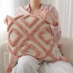 Decorative throw pillows with raised tufted patterns