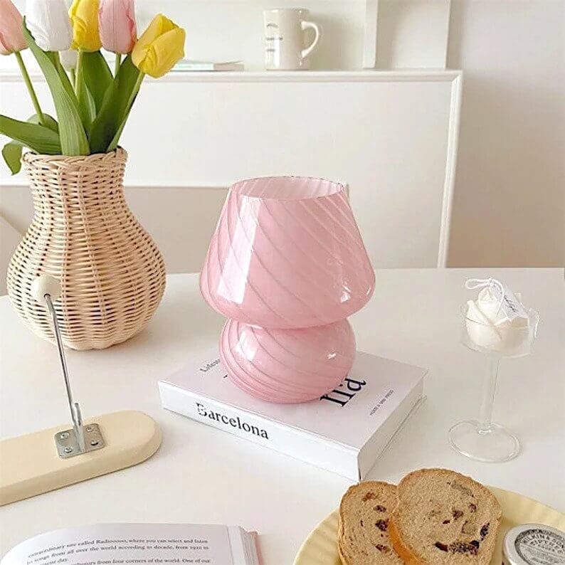 Pink mushroom lamp on table with tulips