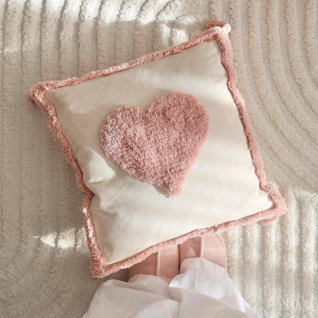 Cozy textured pillow covers with pink and mustard tufting