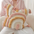 Set of boho-style tufted cushion covers in warm pastel tones